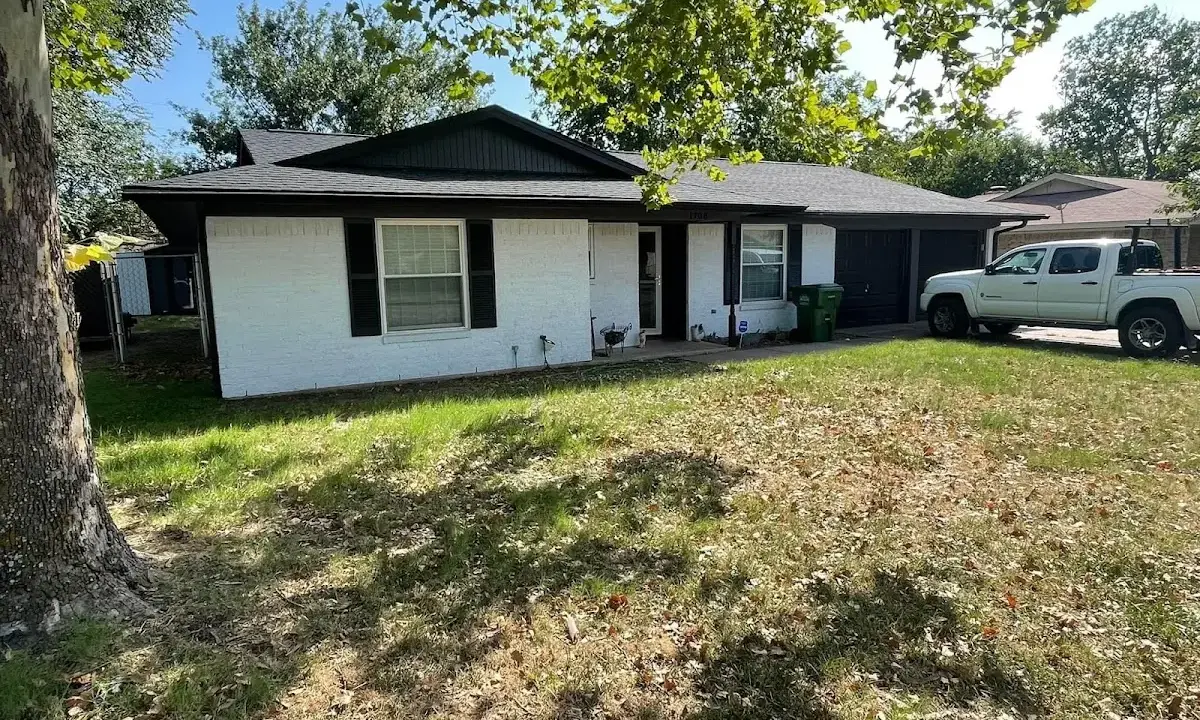 Professional roofing crew working on a residential roof in Idabel